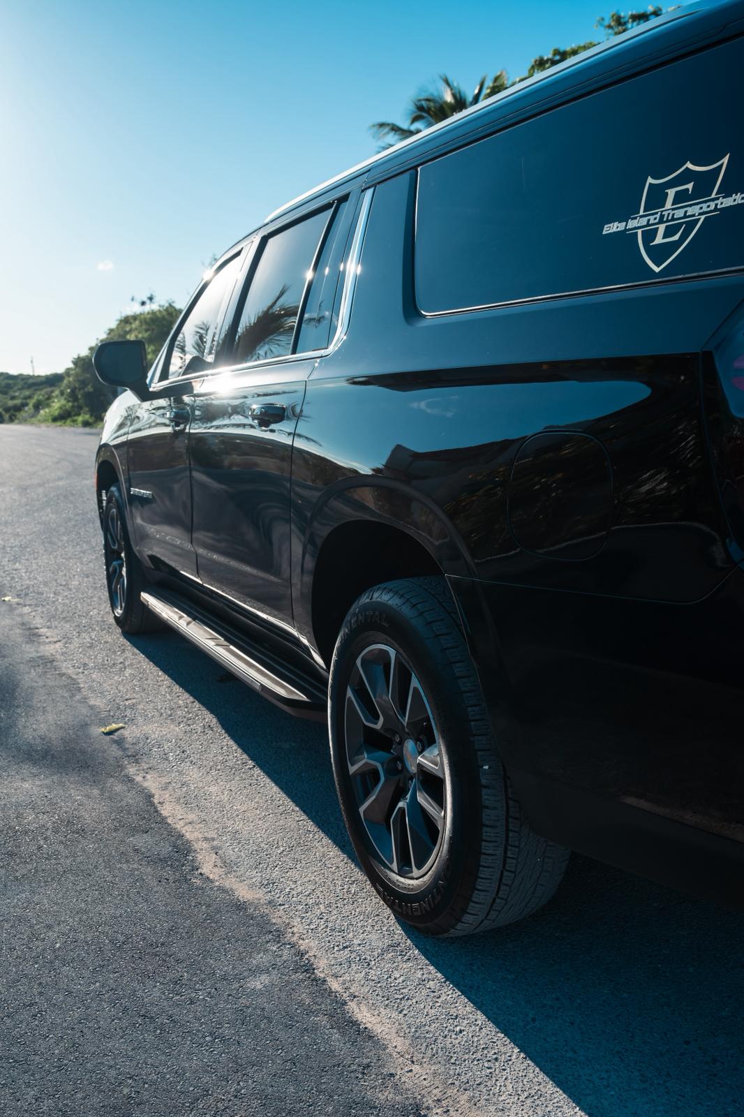 Side view of a luxury black SUV with Elite logo
